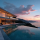 Casa de luxo contemporânea com piscina de borda infinita debruçada sobre o mar ao pôr do sol, exemplificando o conceito de imóvel de luxo que une arquitetura e natureza.